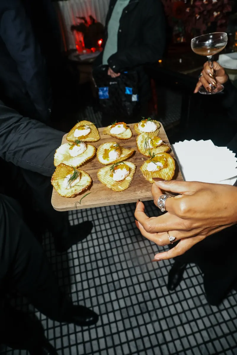An intimate AF Theatricals gathering of guests in conversation